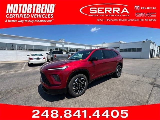 2025 Buick Enclave Sport Touring in Cherry Red Tintcoat — front three-quarter view